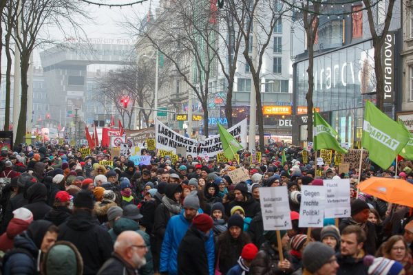 epa06436268 Protesters march during a protest against the new coalition government between Austrian Peoples Party (OeVP) and the right-wing Austrian Freedom Party (FPOe) in Vienna, Austria, 13 January 2018. About 20,000 people took part in the demonstration organized by NGOs, refugee initiatives, political and civic organizations to protest against racism and social cuts of the new Austrian government. EPA/FLORIAN WIESER