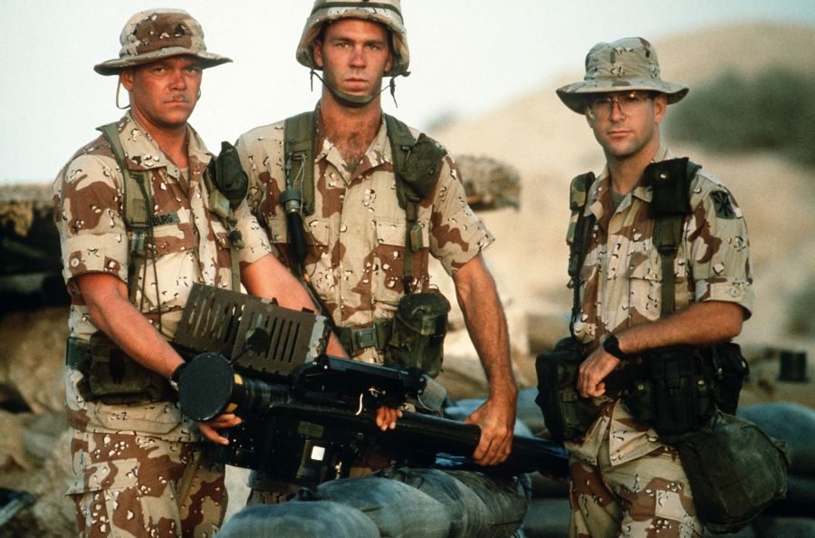 Members of Btry. A, 5162nd Air Defense Arty. Regt., 11th Air Defense Arty. Bde., hold an FIM-92A Stinger portable missile launcher as they pose for a photograph during Operation Desert Shield. (USAF PHOTO BY SSGT F. LEE CORKRAN DA-ST-92-06695)