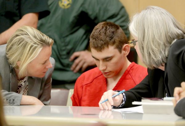 epa06543861 Nikolas Cruz (C) appears in court for a status hearing before Broward Circuit Judge Elizabeth Scherer in Fort Lauderdale, Florida, USA, 19 February 2018. Cruz is facing 17 charges of premeditated murder in the mass shooting at Marjory Stoneman Douglas High School in Parkland, Florida. EPA/MIKE STOCKER/ POOL