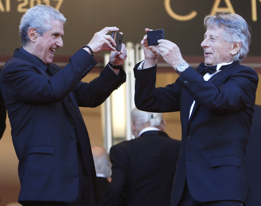 epaselect epa05984918 French director Claude Lelouch (L) and French Polish director Roman Polanski (R) arrive for the 70th Anniversary ceremony during the 70th annual Cannes Film Festival, in Cannes, France, 23 May 2017. The festival runs from 17 to 28 May. EPA/IAN LANGSDON